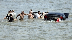 Car plows into crowd at Indiana boat race-car-water.jpg